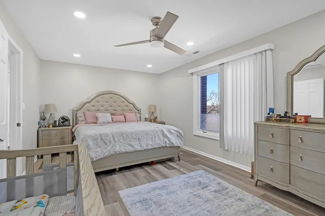 a bedroom with a bed and a dresser