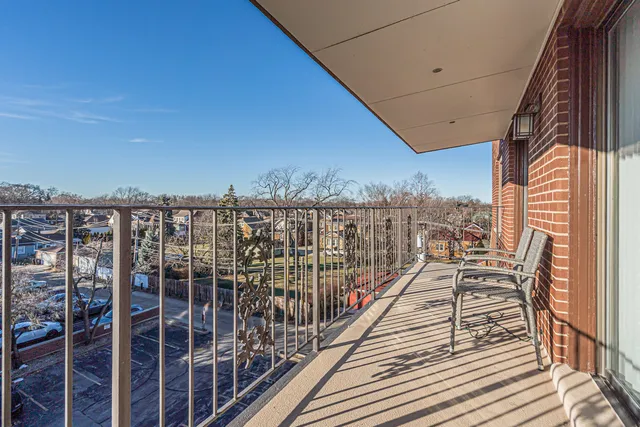 a view of balcony with furniture