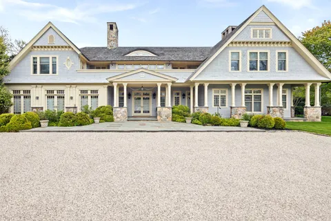front view of a house next to a yard