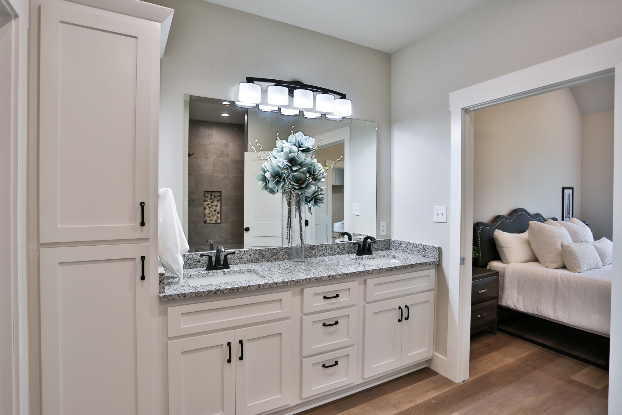 325 String Prairie Way Smithville, TX 78957 - Photo 12 of 23 a en suite bathroom with a granite countertop sink and a mirror