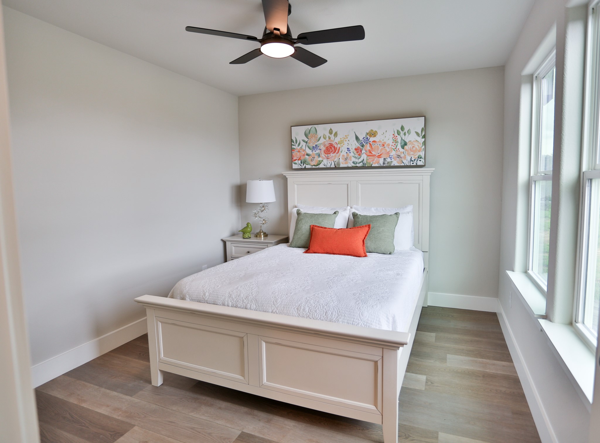 325 String Prairie Way Smithville, TX 78957 - Photo 19 of 23 a bed room with a bed and a chandelier