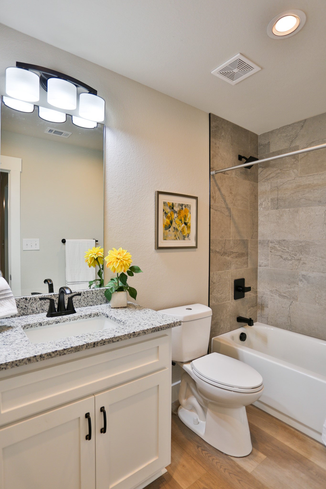 325 String Prairie Way Smithville, TX 78957 - Photo 22 of 23 a bathroom with a granite countertop sink a toilet and shower
