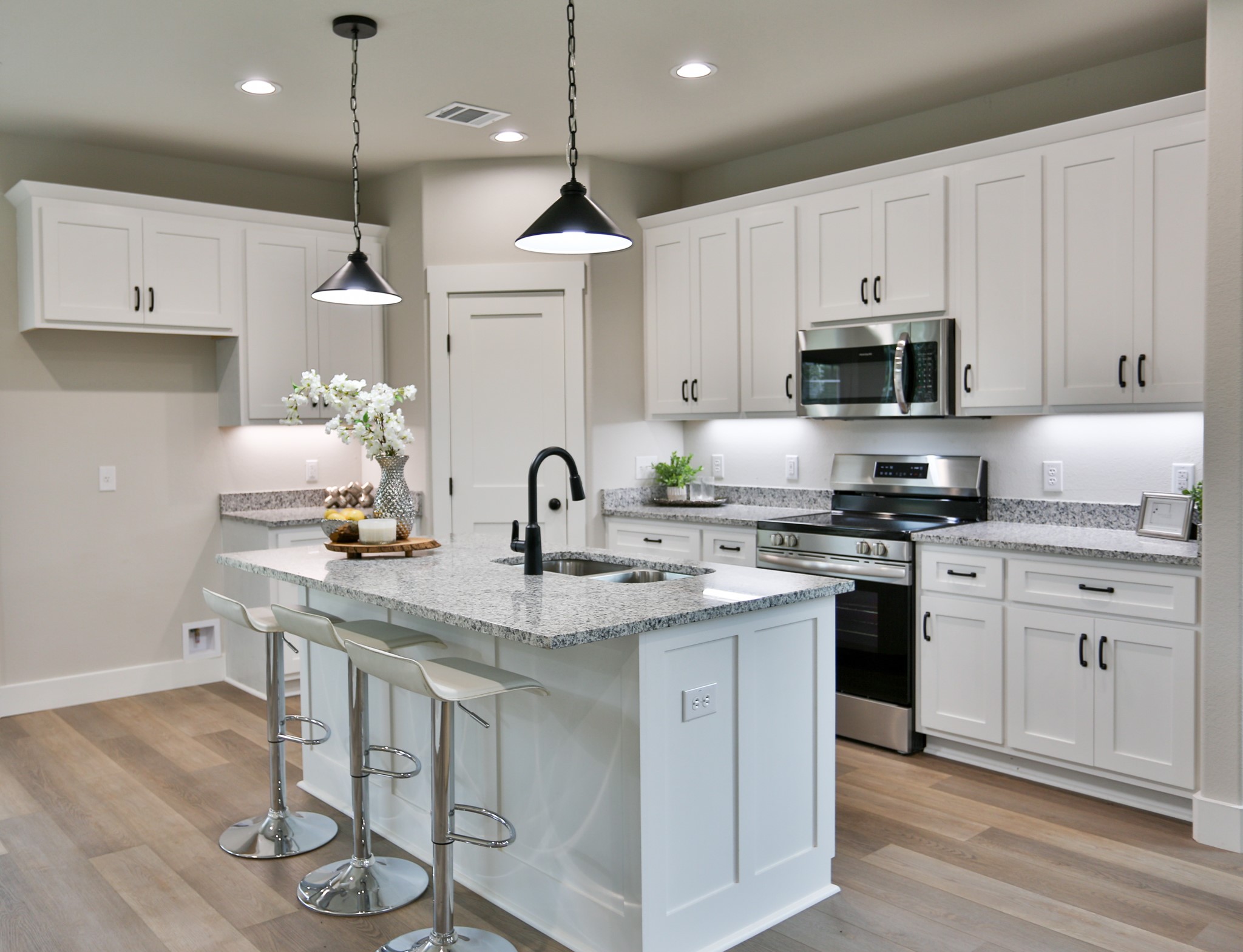 325 String Prairie Way Smithville, TX 78957 - Photo 6 of 23 a kitchen with stainless steel appliances granite countertop a sink a stove a refrigerator and cabinets