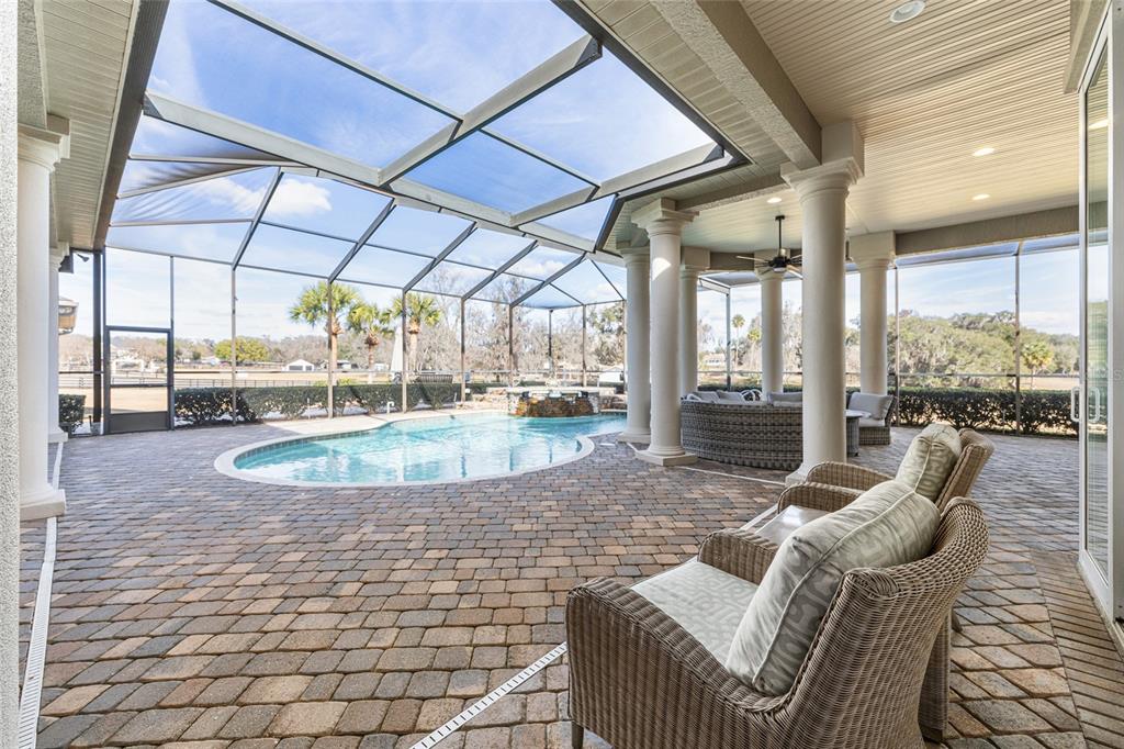 9389 Southwest 14th Avenue Ocala, FL 34476 - Photo 26 of 59 a view of a swimming pool with a patio