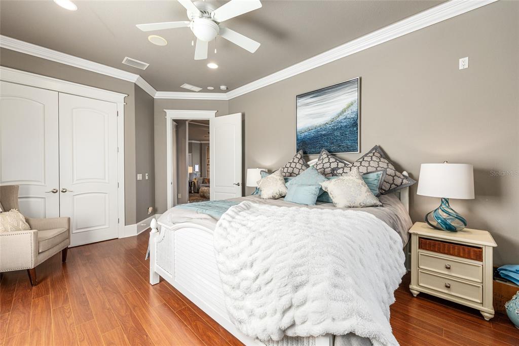 9389 Southwest 14th Avenue Ocala, FL 34476 - Photo 34 of 59 a spacious bedroom with a bed and a couch