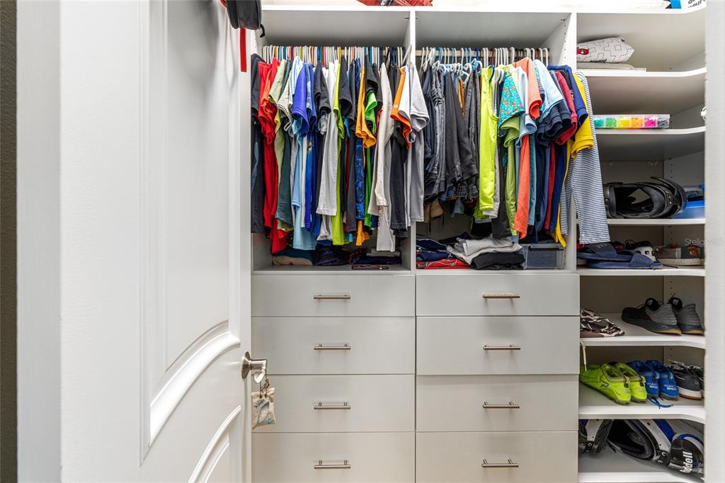 9389 Southwest 14th Avenue Ocala, FL 34476 - Photo 36 of 59 a view of walk in closet with clothes and shoes