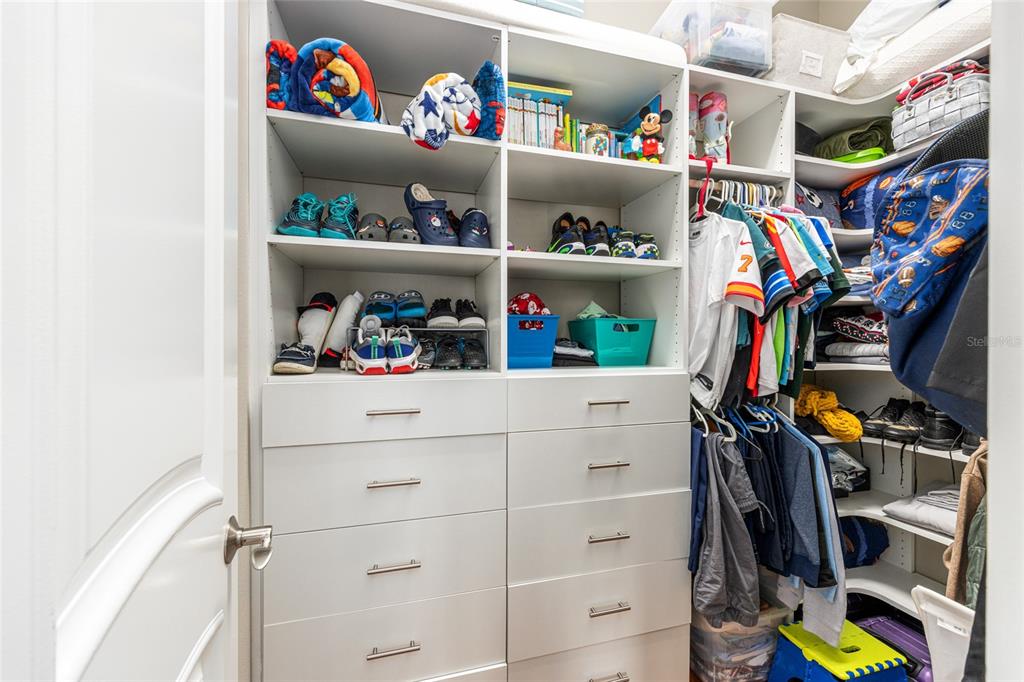 9389 Southwest 14th Avenue Ocala, FL 34476 - Photo 38 of 59 a view of walk in closet with clothes and shoes