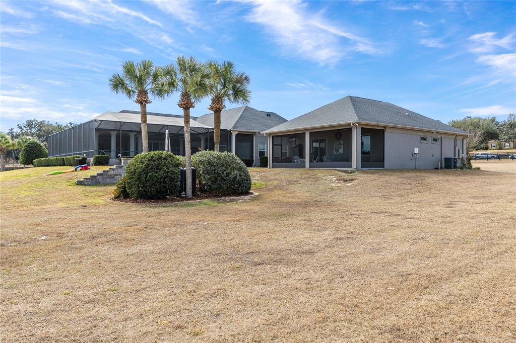 9389 Southwest 14th Avenue Ocala, FL 34476 - Photo 59 of 59 a front view of a house with a garden
