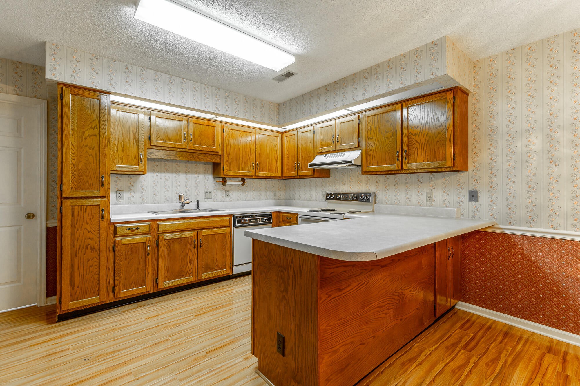 6780 Hickory Creek Road Chattanooga, TN 37421 - Photo 11 of 60 a kitchen with stainless steel appliances granite countertop a sink stove and cabinets