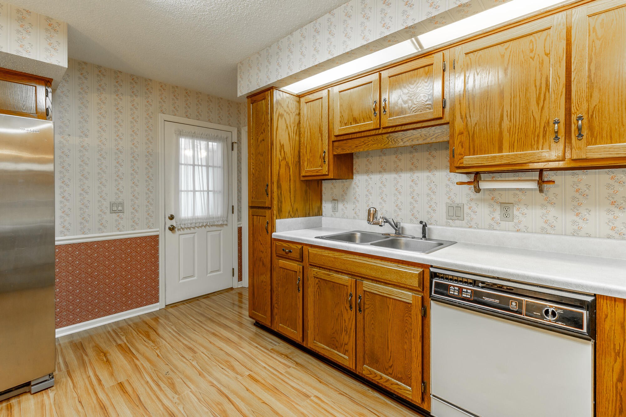 6780 Hickory Creek Road Chattanooga, TN 37421 - Photo 14 of 60 a kitchen with stainless steel appliances granite countertop a sink cabinets and wooden floor