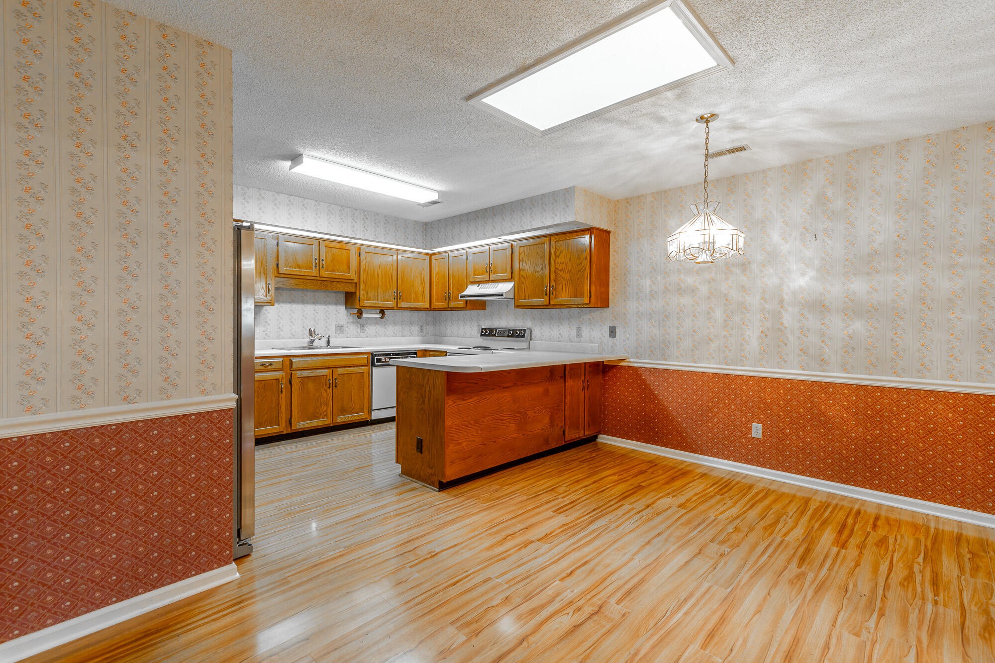 6780 Hickory Creek Road Chattanooga, TN 37421 - Photo 19 of 60 a kitchen with stainless steel appliances granite countertop a sink counter space and cabinets