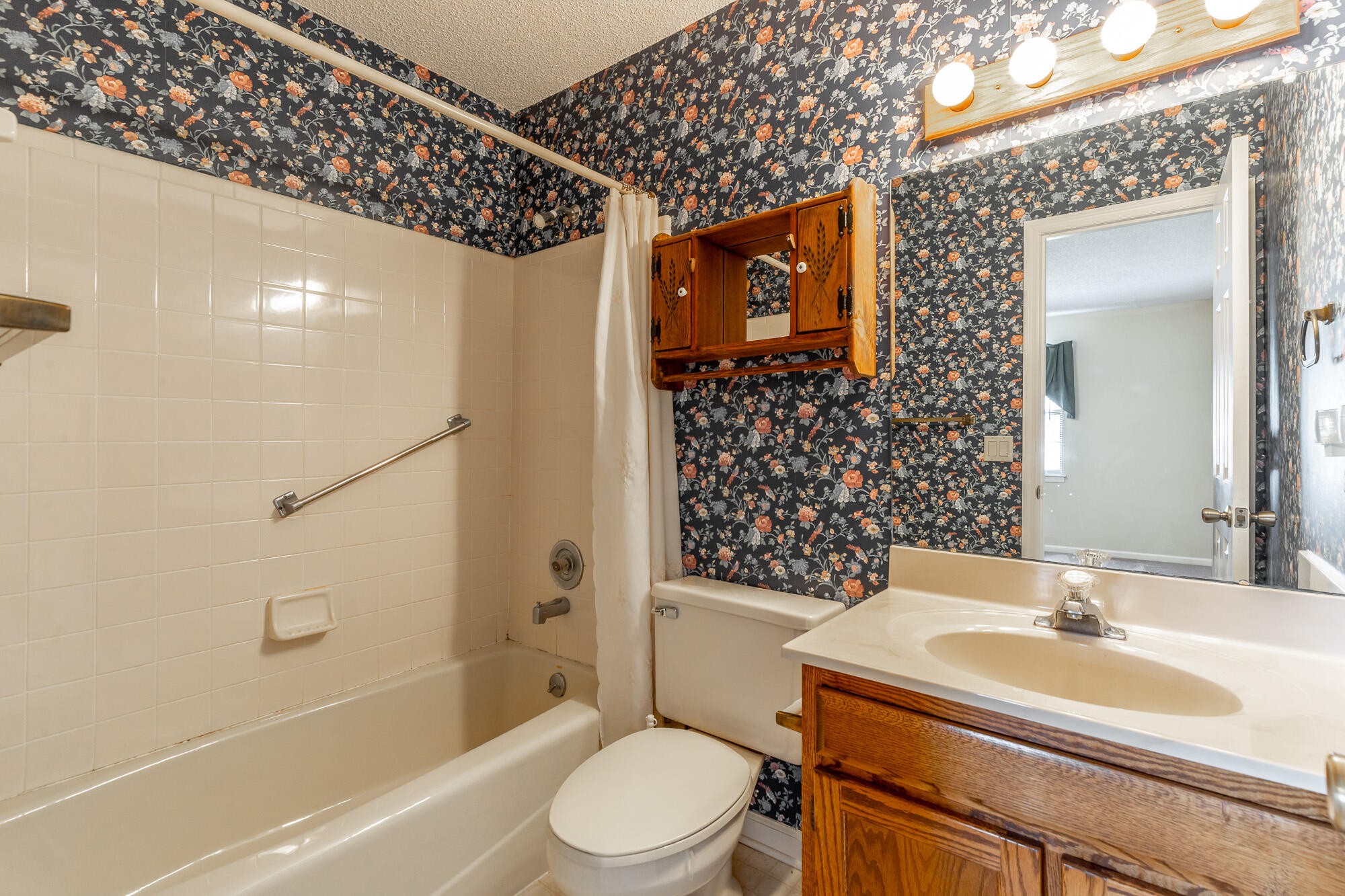 6780 Hickory Creek Road Chattanooga, TN 37421 - Photo 26 of 60 a bathroom with a sink toilet vanity and shower