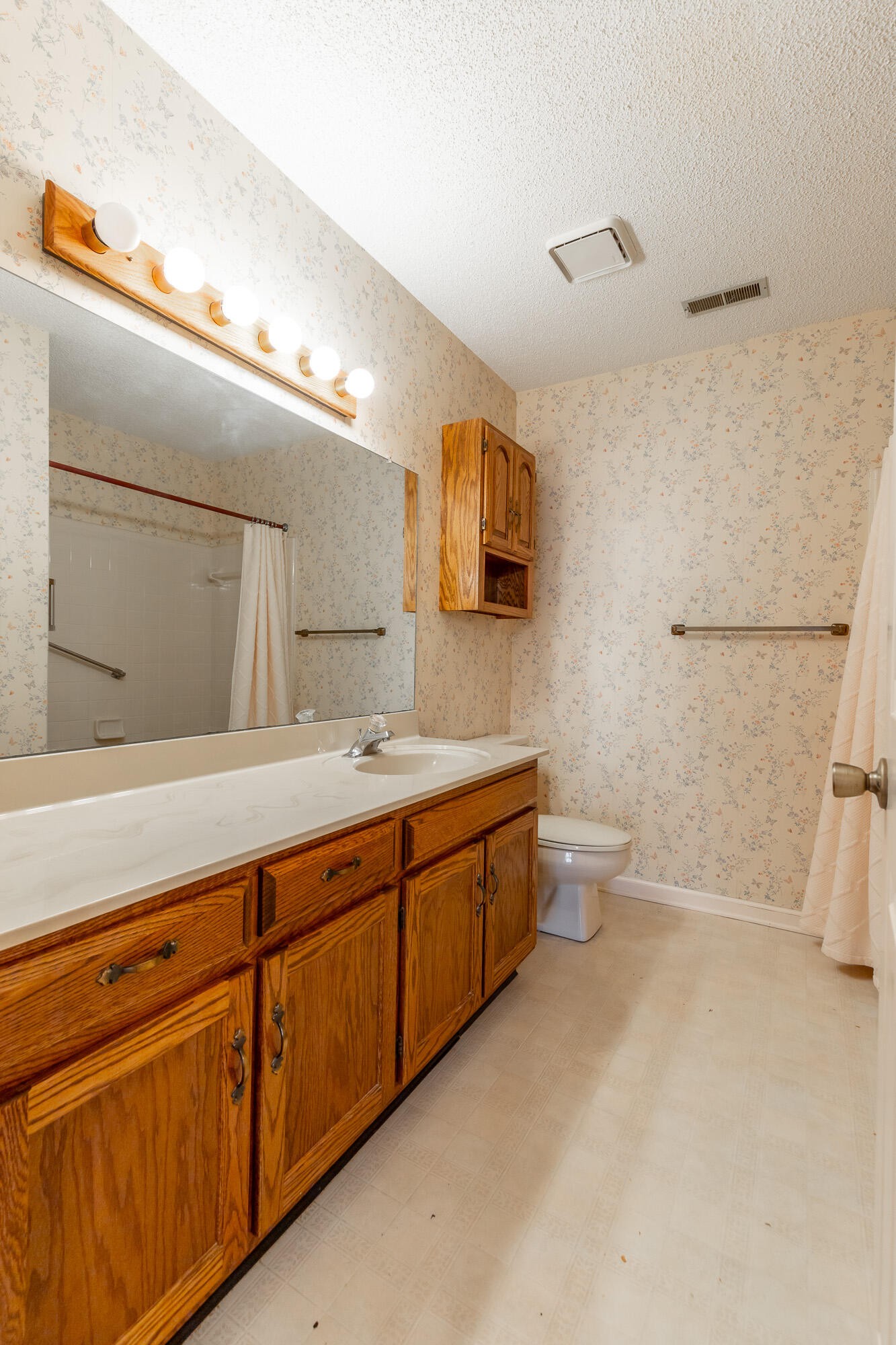 6780 Hickory Creek Road Chattanooga, TN 37421 - Photo 33 of 60 a spacious bathroom with a double vanity sink a mirror and a toilet