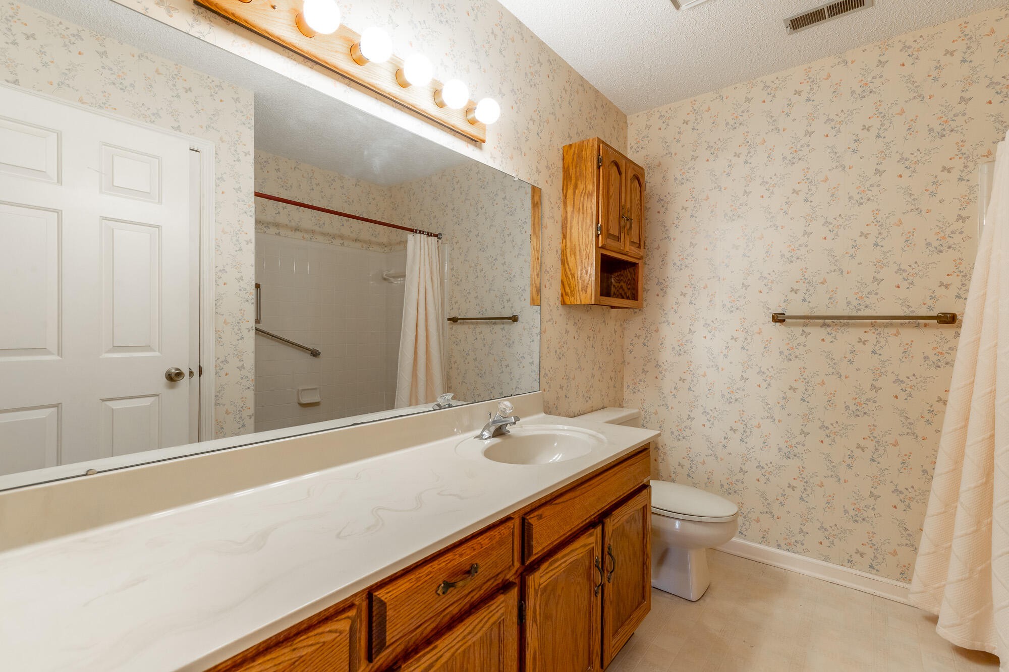 6780 Hickory Creek Road Chattanooga, TN 37421 - Photo 34 of 60 a bathroom with a sink a toilet and shower