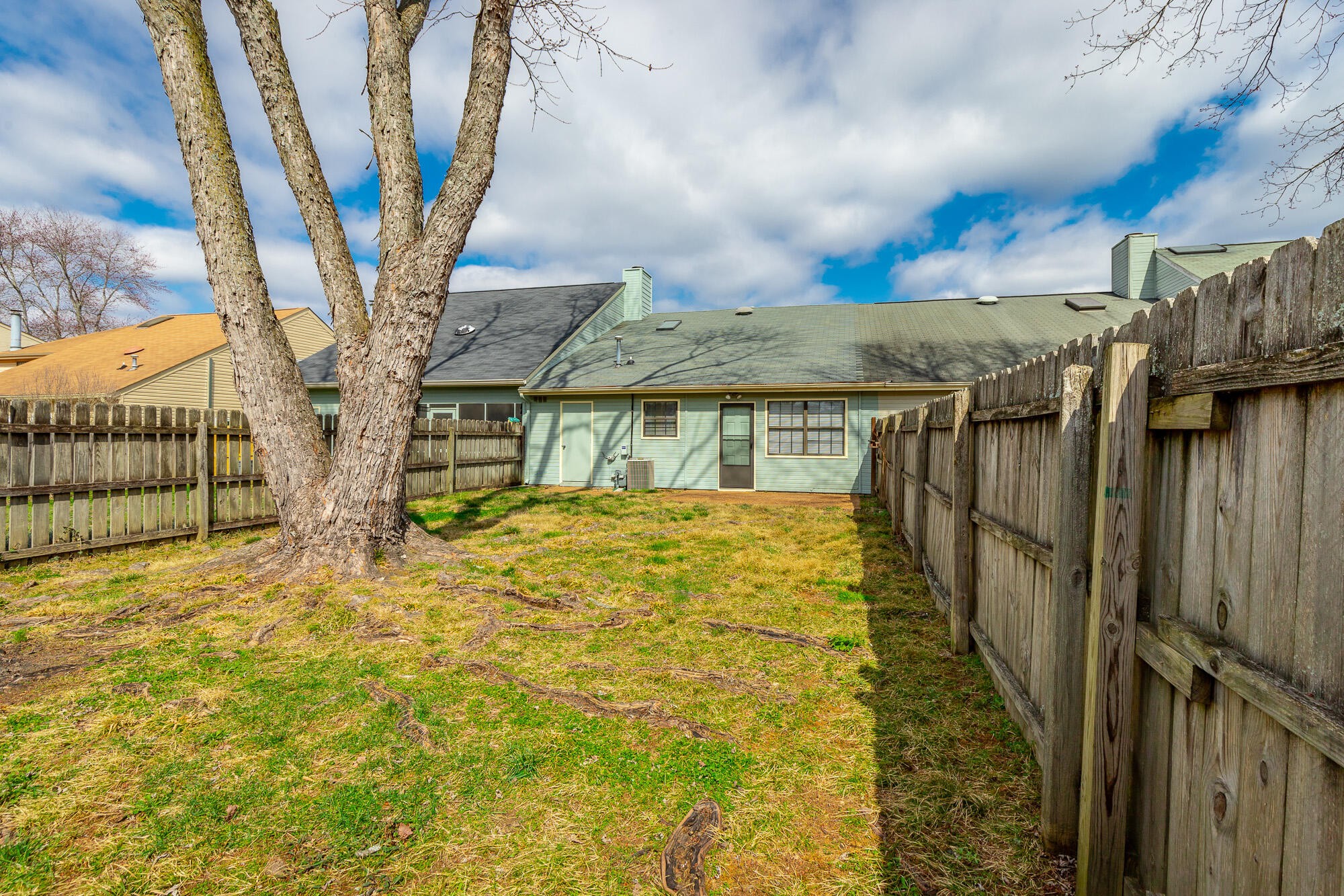 6780 Hickory Creek Road Chattanooga, TN 37421 - Photo 55 of 60 a yellow house with trees in front of it