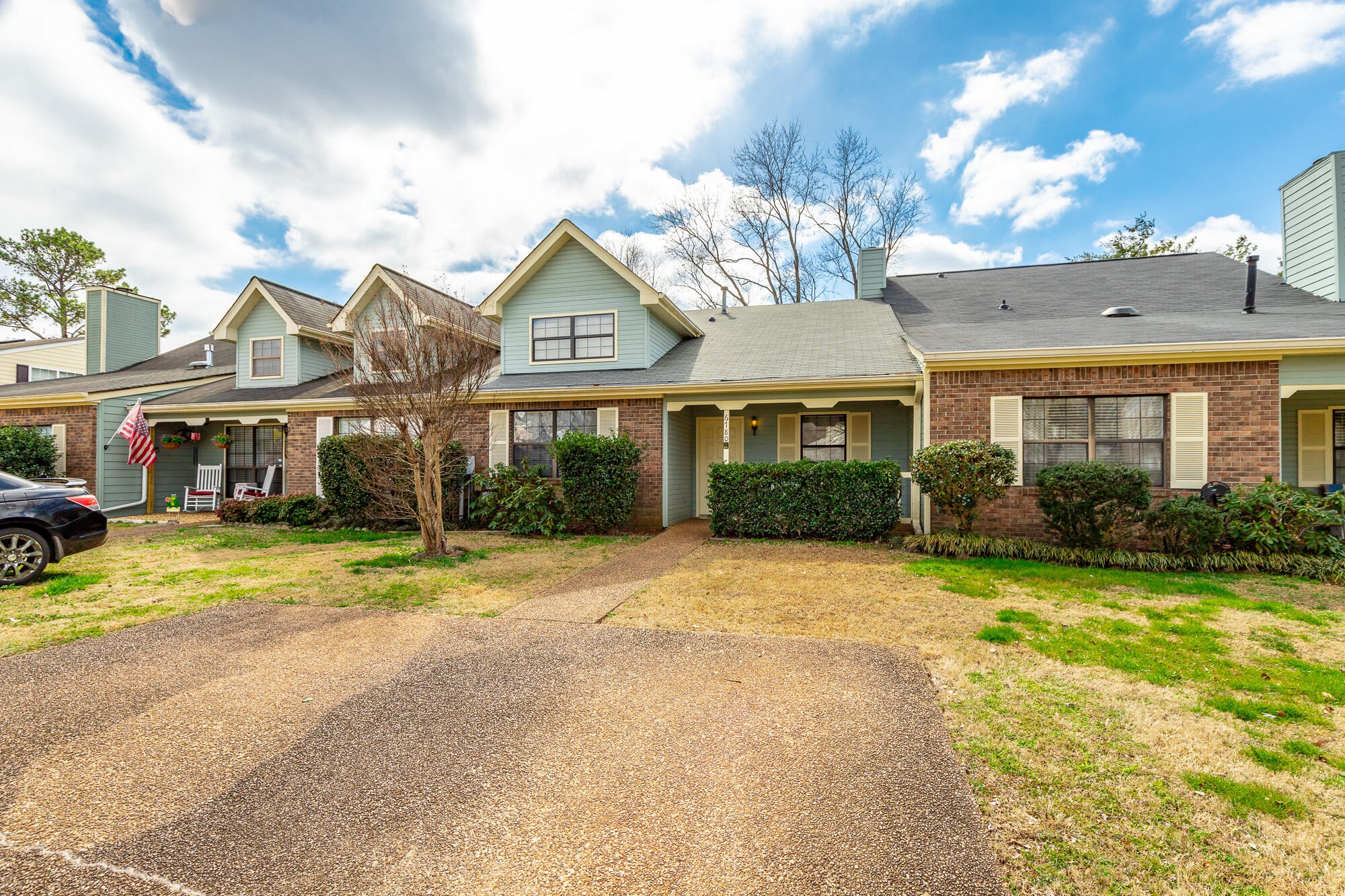 6780 Hickory Creek Road Chattanooga, TN 37421 - Photo 58 of 60 a front view of a house with a garden and patio