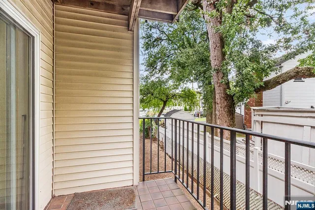 a view of a balcony with a trees