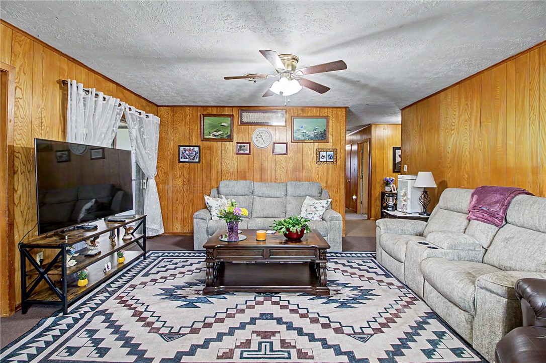 11576 Carter Lane Bryan, TX 77808 - Photo 19 of 50 a living room with furniture and a flat screen tv