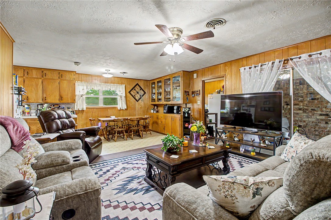 11576 Carter Lane Bryan, TX 77808 - Photo 21 of 50 a living room with furniture and a flat screen tv