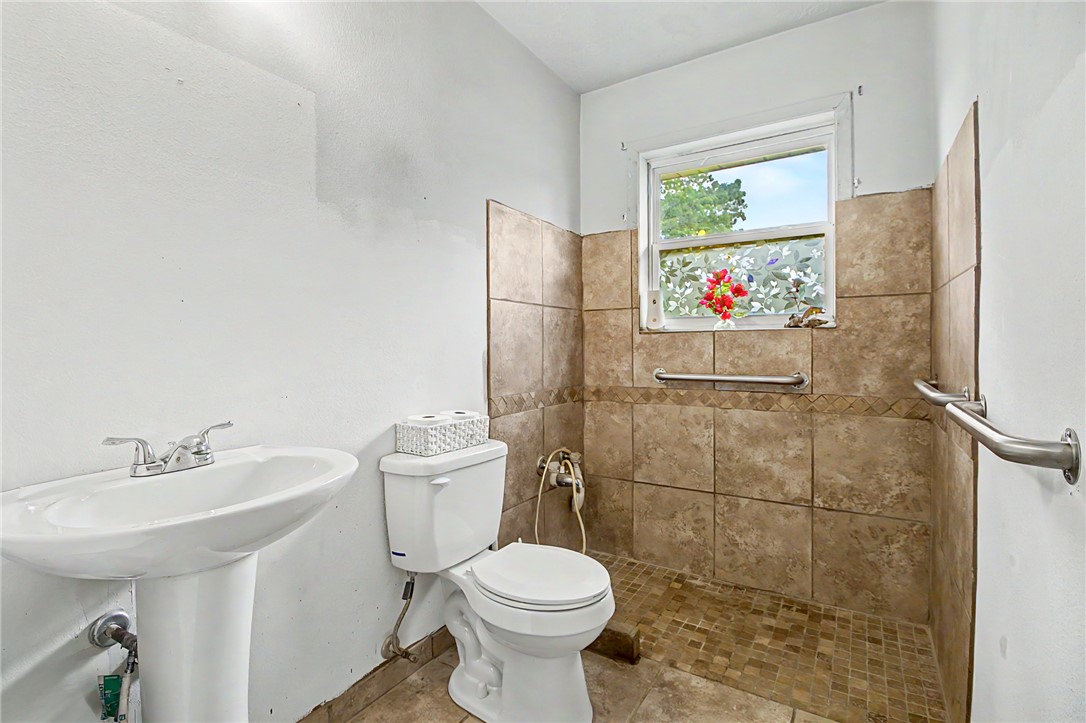 11576 Carter Lane Bryan, TX 77808 - Photo 24 of 50 a bathroom with a toilet sink and mirror