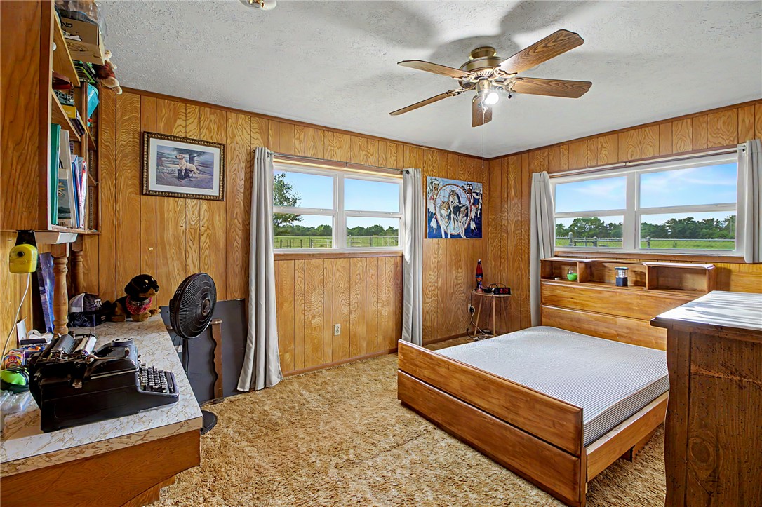 11576 Carter Lane Bryan, TX 77808 - Photo 26 of 50 a bedroom with furniture and a large window