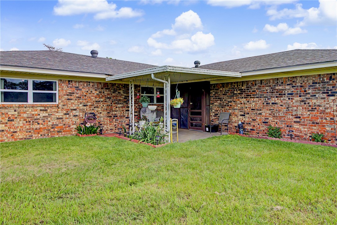 11576 Carter Lane Bryan, TX 77808 - Photo 30 of 50 a view of a porch with a yard