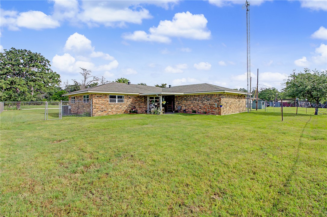 11576 Carter Lane Bryan, TX 77808 - Photo 31 of 50 a view of a house with a yard and sitting area