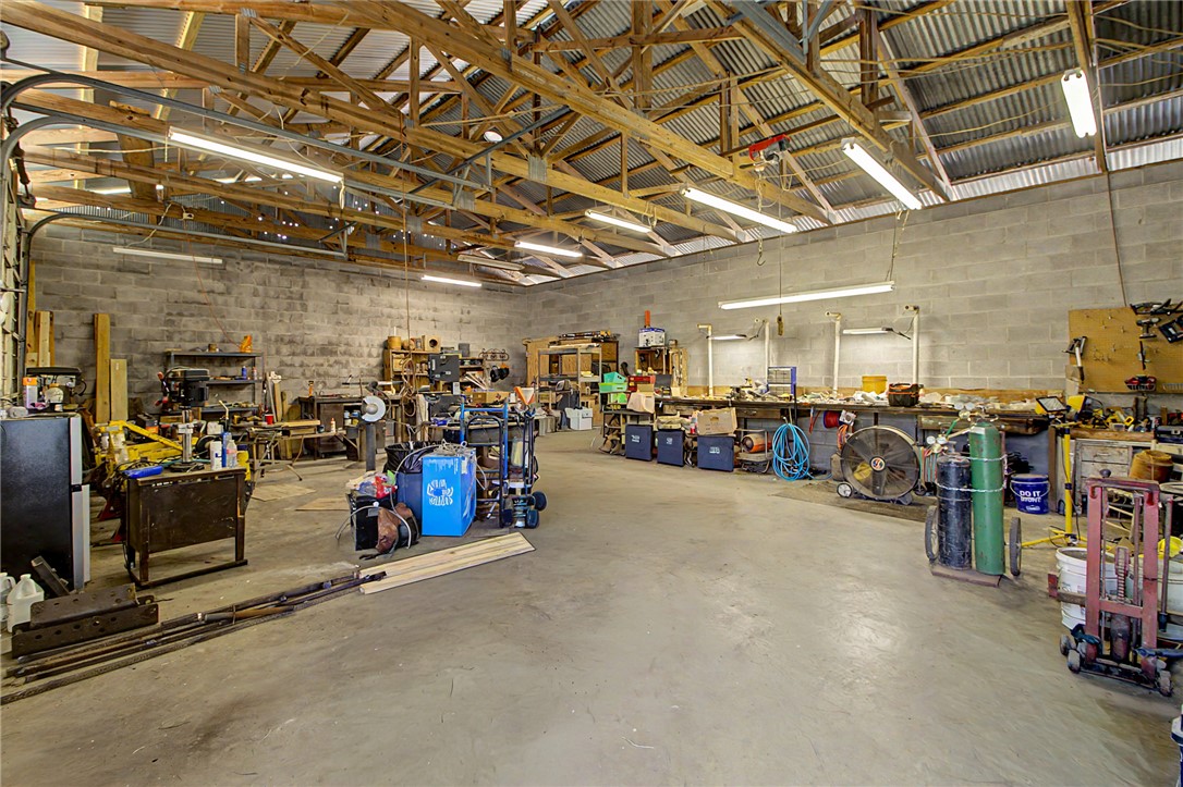 11576 Carter Lane Bryan, TX 77808 - Photo 34 of 50 a view of a garage with a bike and storage