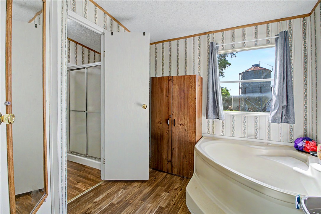 11576 Carter Lane Bryan, TX 77808 - Photo 41 of 50 a bathroom with a tub and shower