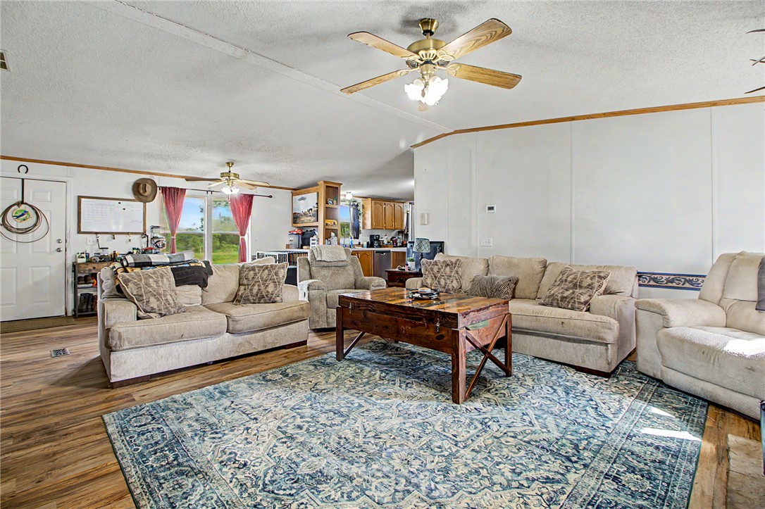 11576 Carter Lane Bryan, TX 77808 - Photo 43 of 50 a living room with furniture ceiling fan and a rug
