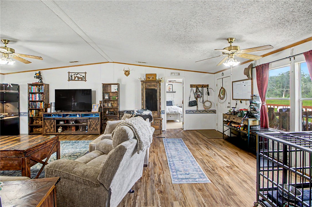 11576 Carter Lane Bryan, TX 77808 - Photo 44 of 50 a living room with furniture and a flat screen tv