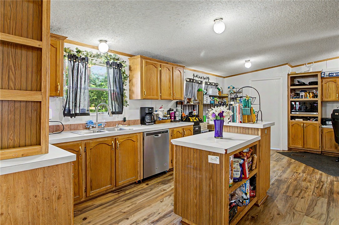 11576 Carter Lane Bryan, TX 77808 - Photo 46 of 50 a kitchen with stainless steel appliances granite countertop a sink stove and refrigerator