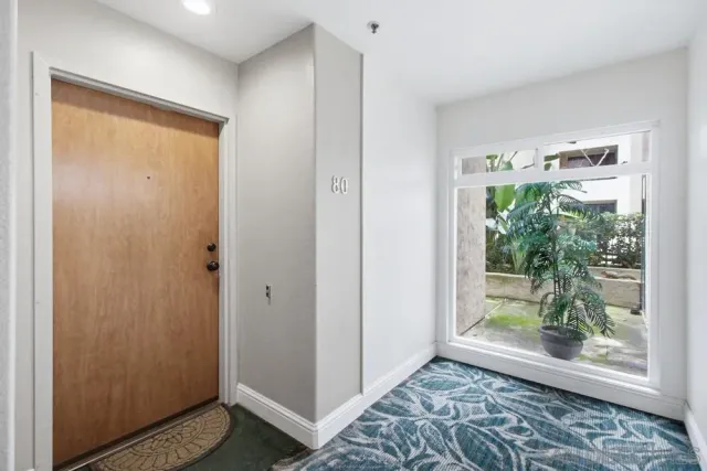 a bedroom with a bed and a table