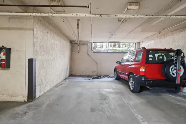 a view of a building with a swimming pool and sitting area