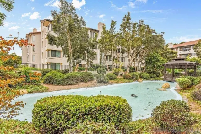 a view of yard with swimming pool and sitting area