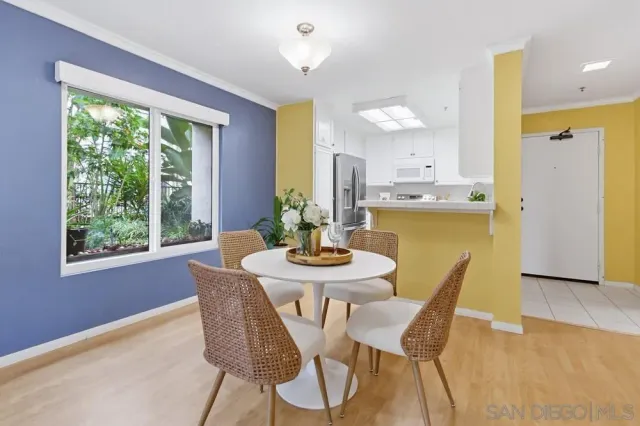 a dining room with furniture and window