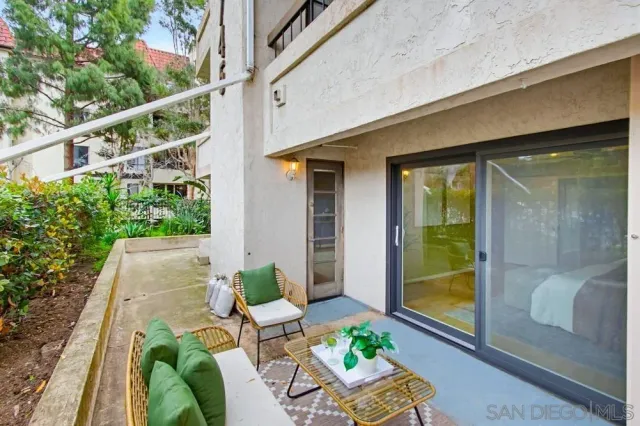 a view of balcony with furniture