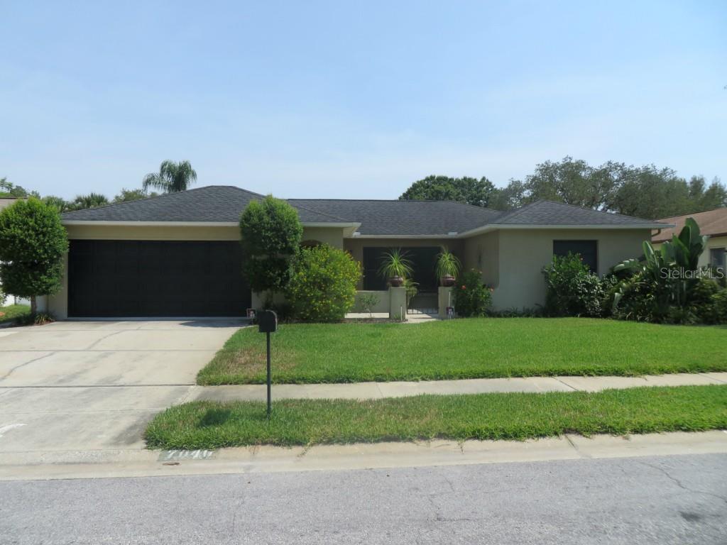 7040 Arbor View Lane New Port Richey, FL 34653 - Photo 1 of 1 Pristine Front Yard
