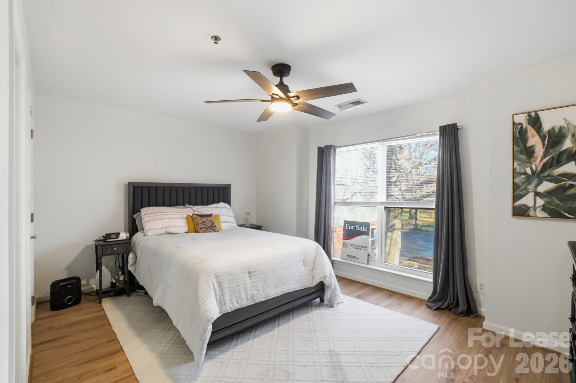 525 North Graham Street, Unit 2F Charlotte, NC 28202 - Photo 12 of 18 a bedroom with a bed and a window