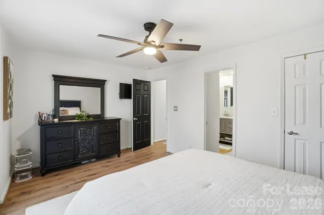 a bedroom with a bed and a dresser