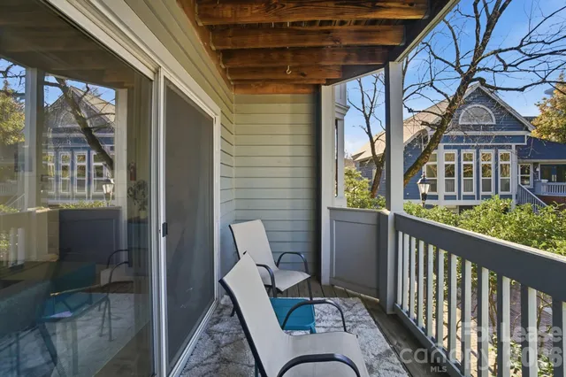 a view of a balcony with furniture