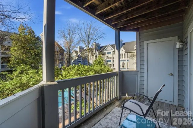a view of a two chairs in the balcony
