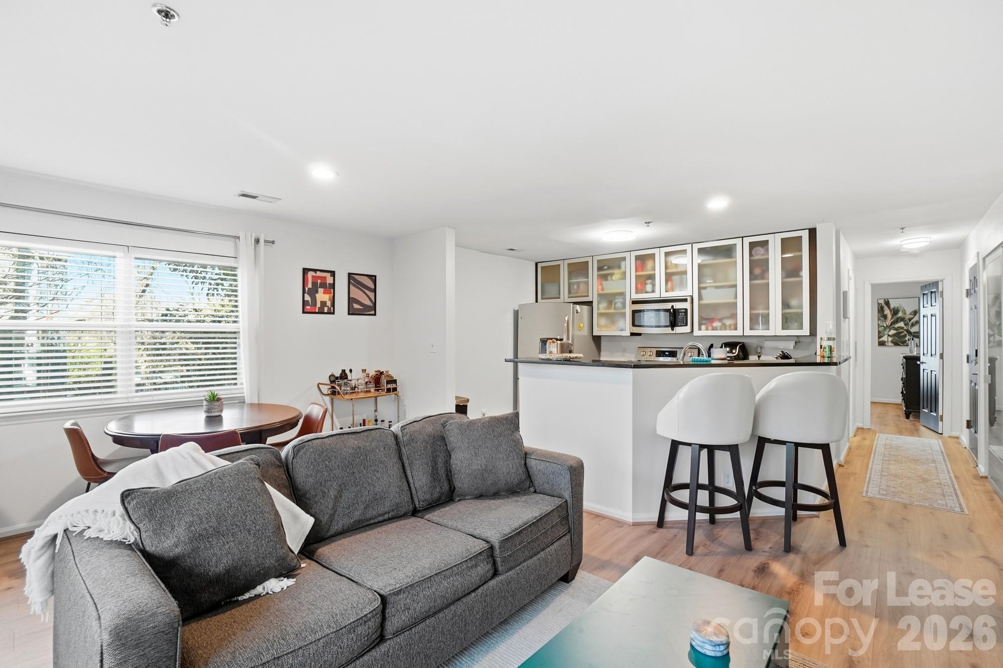 525 North Graham Street, Unit 2F Charlotte, NC 28202 - Photo 6 of 18 a living room with furniture and a large window