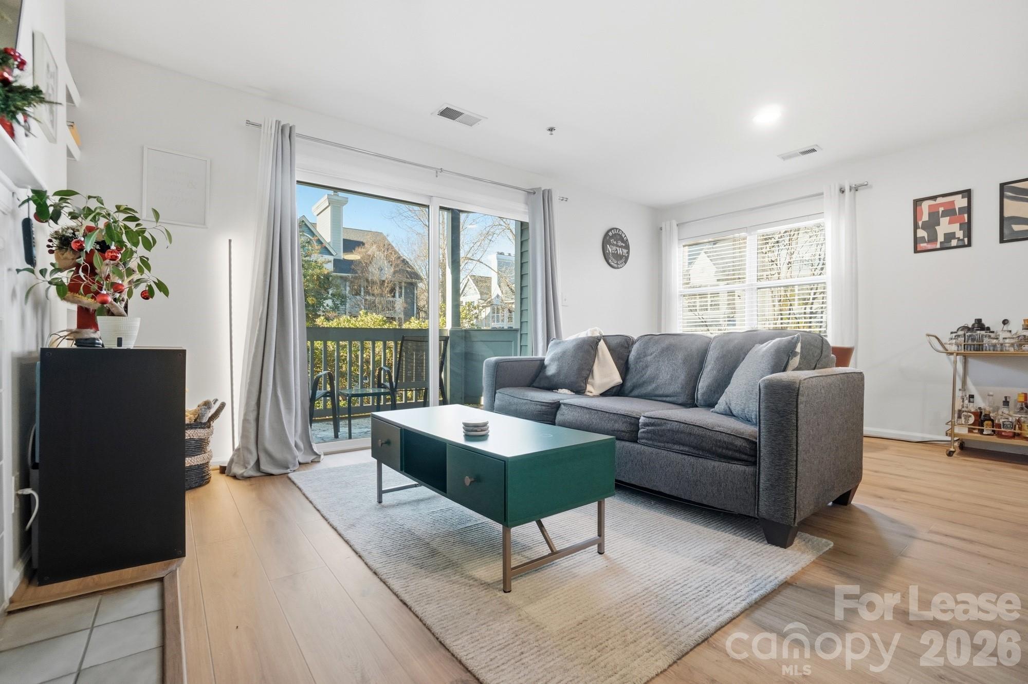 525 North Graham Street, Unit 2F Charlotte, NC 28202 - Photo 7 of 18 a living room with furniture and a large window