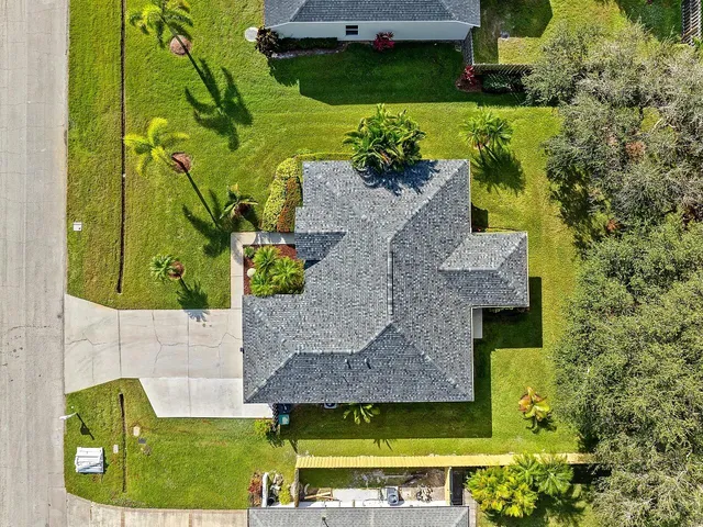 an aerial view of a house with a garden