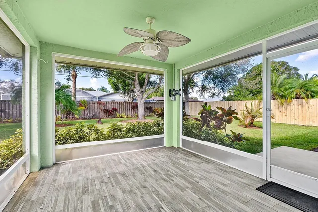 a view of a porch with wooden floor and outdoor space