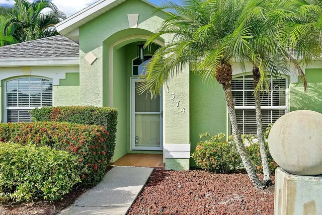 a view of a house with a garden