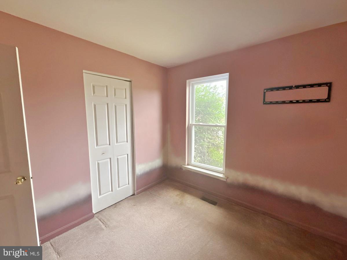 3 Morning Star Court Baltimore, MD 21206 - Photo 13 of 28 a view of an empty room with a window