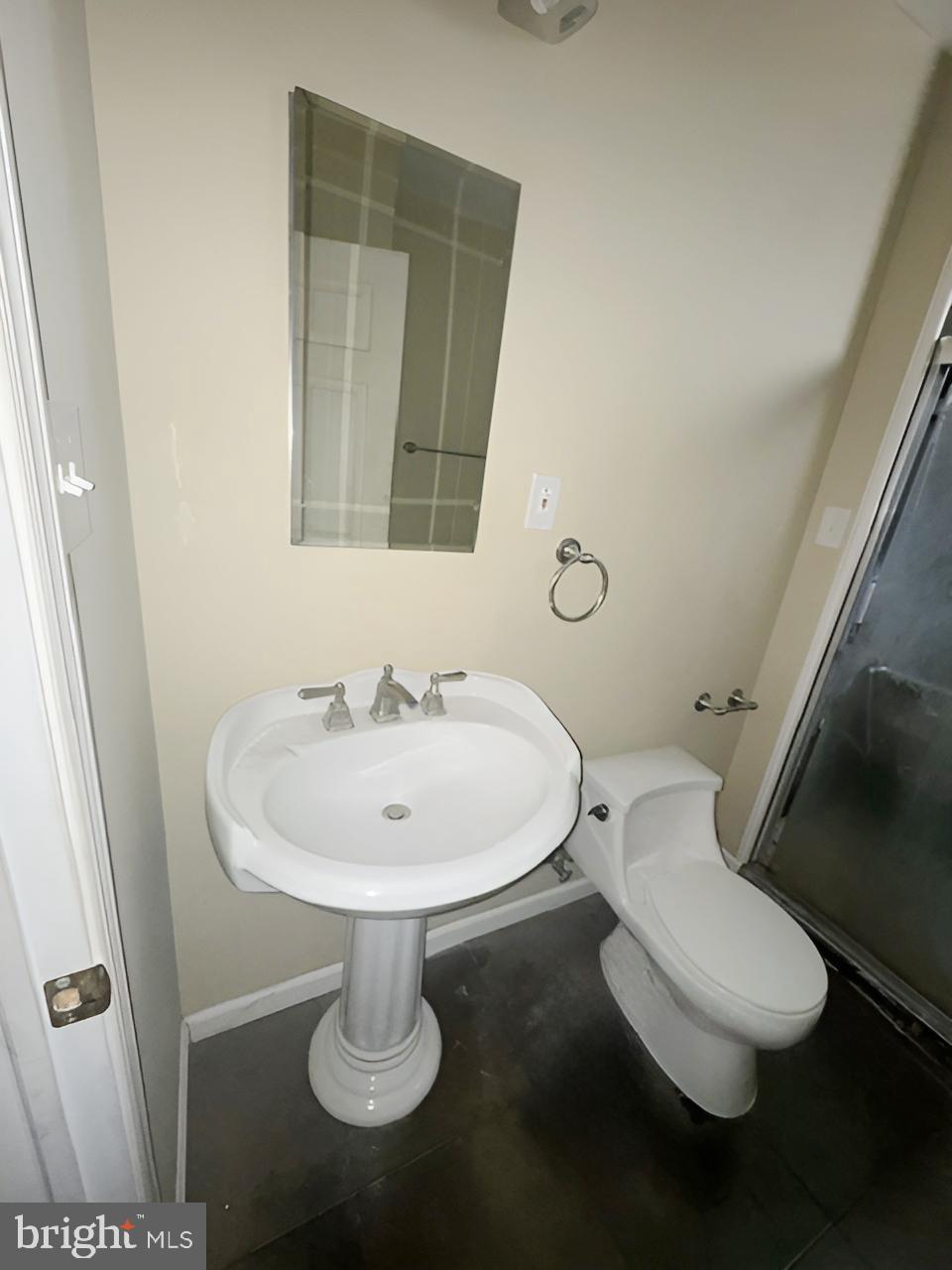 3 Morning Star Court Baltimore, MD 21206 - Photo 21 of 28 a bathroom with a toilet a sink and mirror