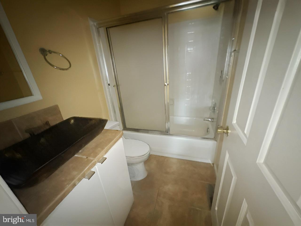 3 Morning Star Court Baltimore, MD 21206 - Photo 23 of 28 a bathroom with a granite countertop sink toilet and shower